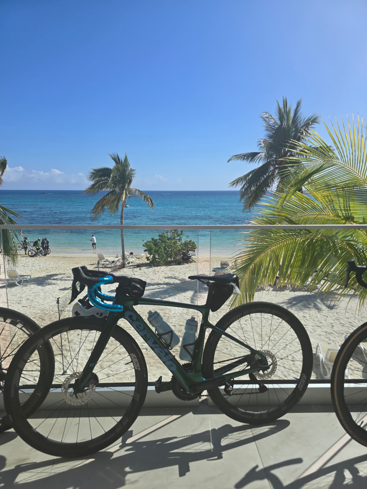 Road bikes lined up on a balcony above the beach in Jamaica